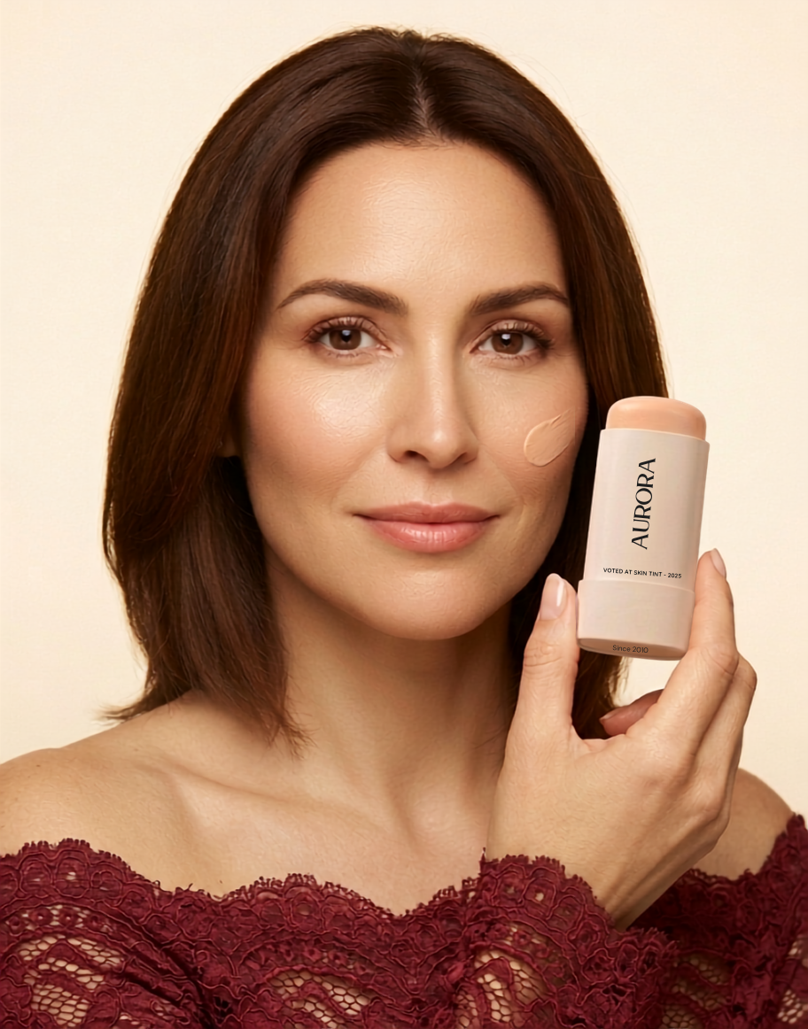 Woman holding AURORA serum boosted skin tint balm